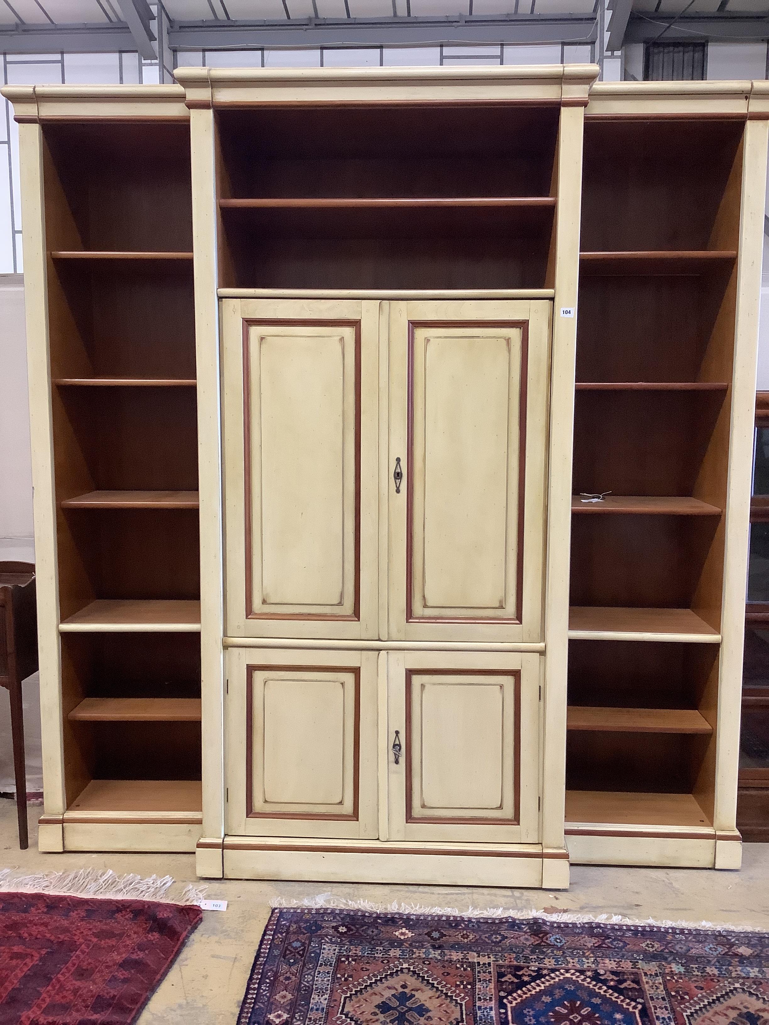 A reproduction Continental painted breakfront bookcase / media cabinet, width 204cm, depth 55cm, height 222cm